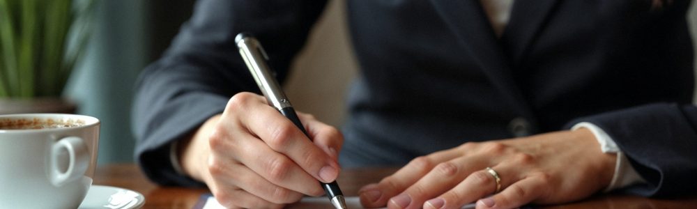 close-up-lawyer-signing-papers